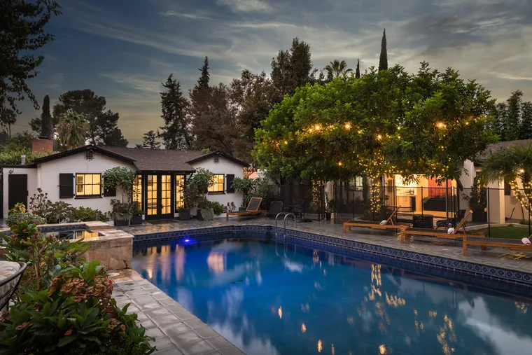Westside backyard pool at twilight with string lights — 10 Good Things August 2026 newsletter by Alex Hoerner