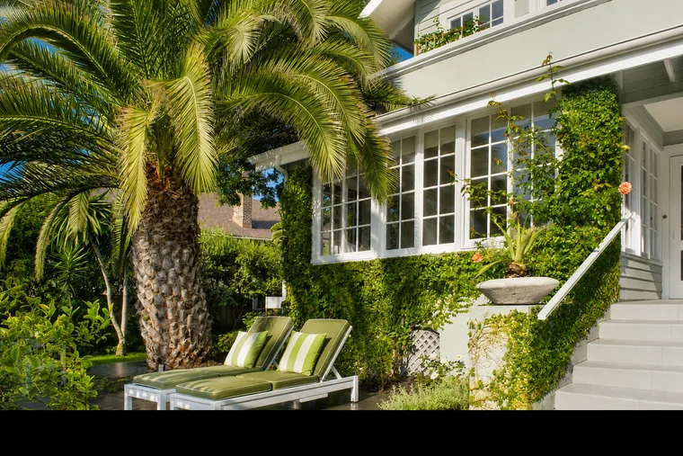 Sunlit California porch with palm tree and green lounge chairs — 10 Good Things July 2026 newsletter by Alex Hoerner