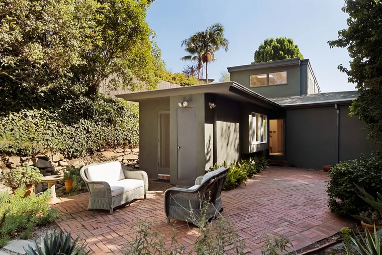 Sunlit brick courtyard of a mid-century Rustic Canyon home — 10 Good Things September 2026 newsletter by Alex Hoerner